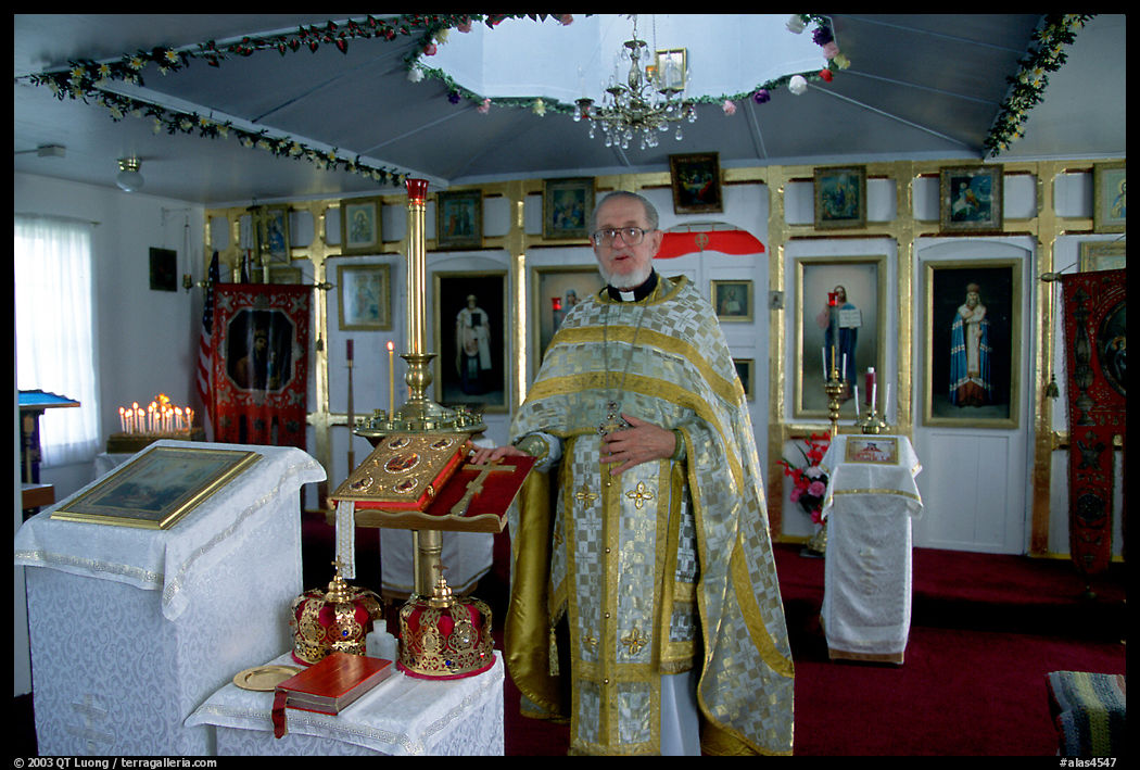 Orthodox priest inside the old Russian church. Ninilchik, Kenai Peninsula, Alaska, USA