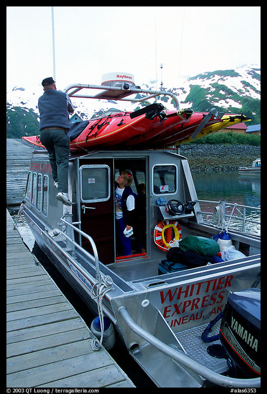 Kayaks loaded on a water taxi in Whittier. Whittier, Alaska, USA