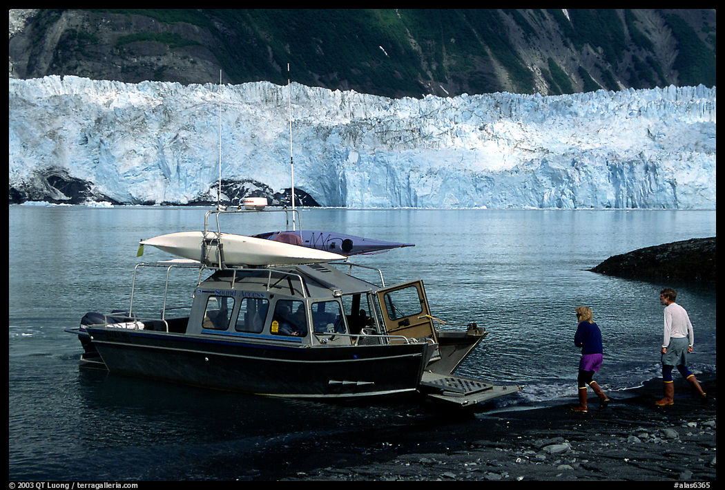 Water taxi boats lands on Black Sand Beach. Prince William Sound, Alaska, USA