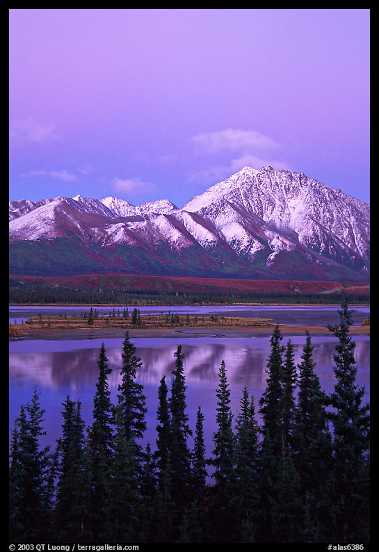 Snowy peaks and lake at dusk. Denali Highway, Central Alaska, USA