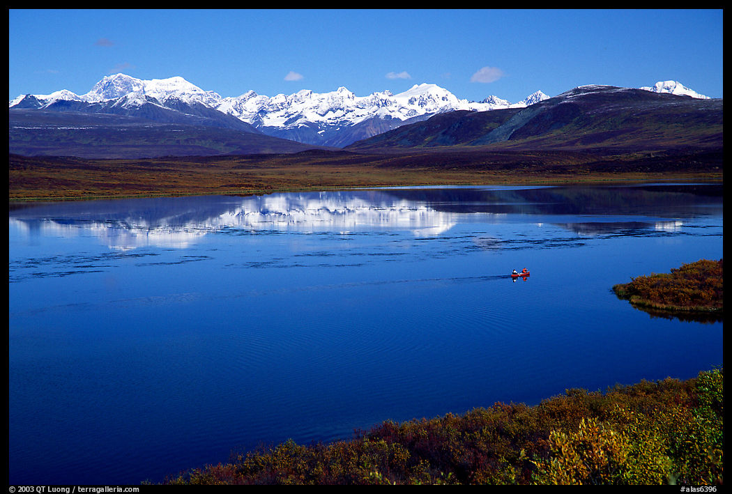 Lake with snowy peaks reflected. Denali Highway, Central Alaska, USA