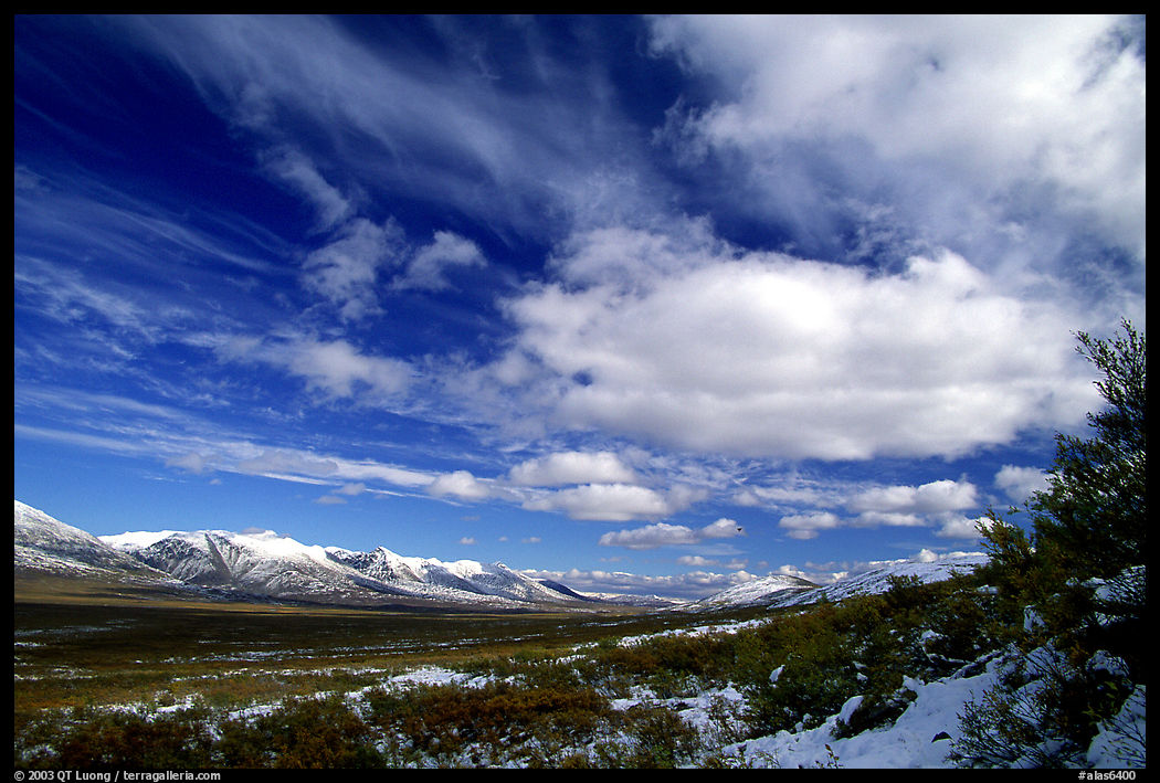 Valley and large white clouds. Denali Highway, Central Alaska, USA