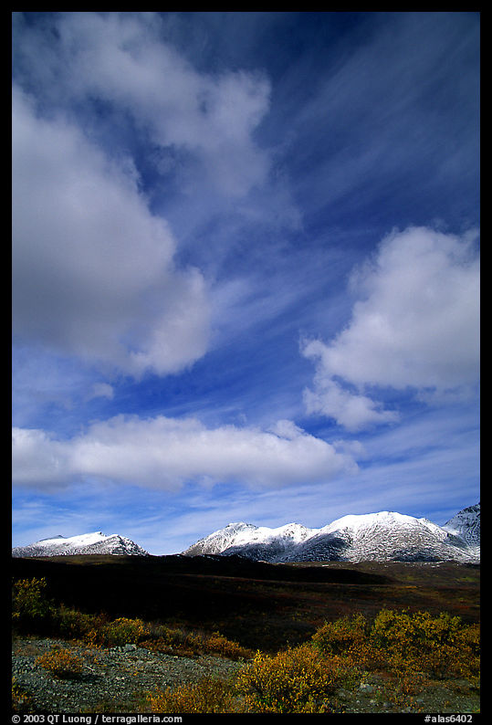 Mountain landscape with large white clouds. Denali Highway, Central Alaska, USA