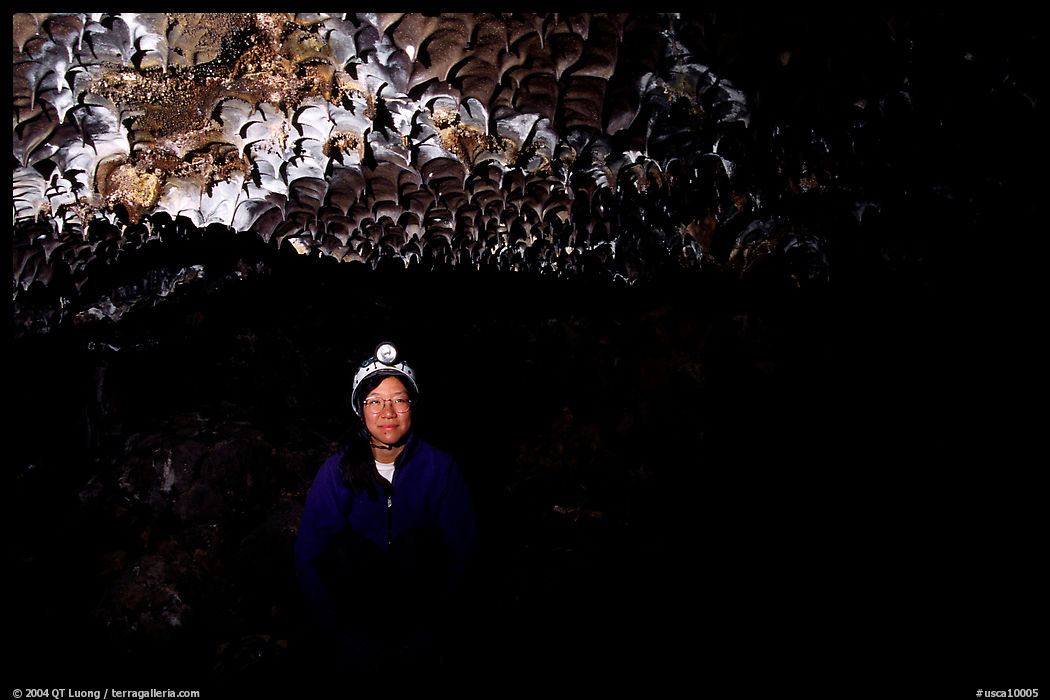 Caver inside a lava tube, Lava Beds National Monument. California, USA