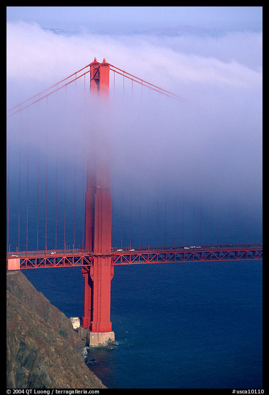 Golden Gate bridge with top covered by fog. San Francisco, California, USA
