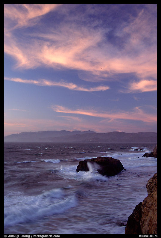 Surf and rocks at sunset seen from the Cliff House. San Francisco, California, USA