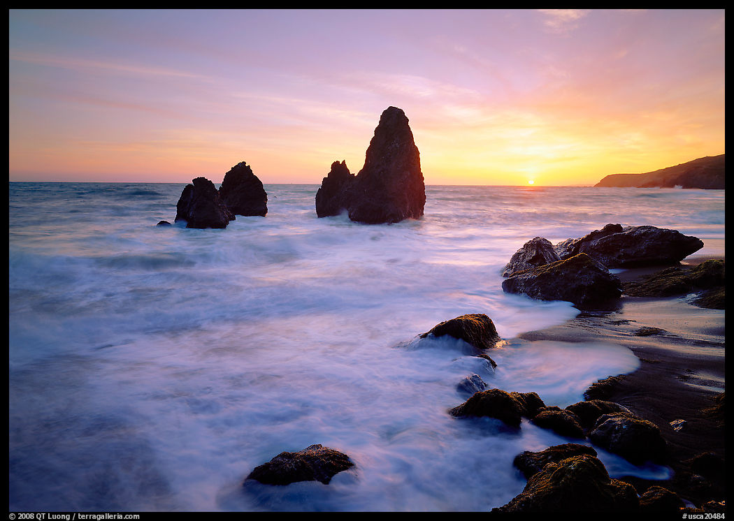 Wave action, seastacks and rocks with sun setting, Rodeo Beach. SF Bay area, California, USA