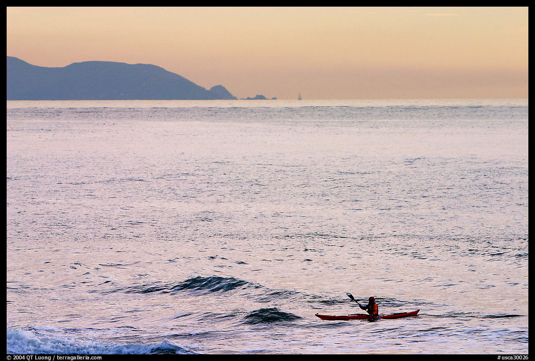 Sea kayaker, Rodeo Beach, sunset. SF Bay area, California, USA