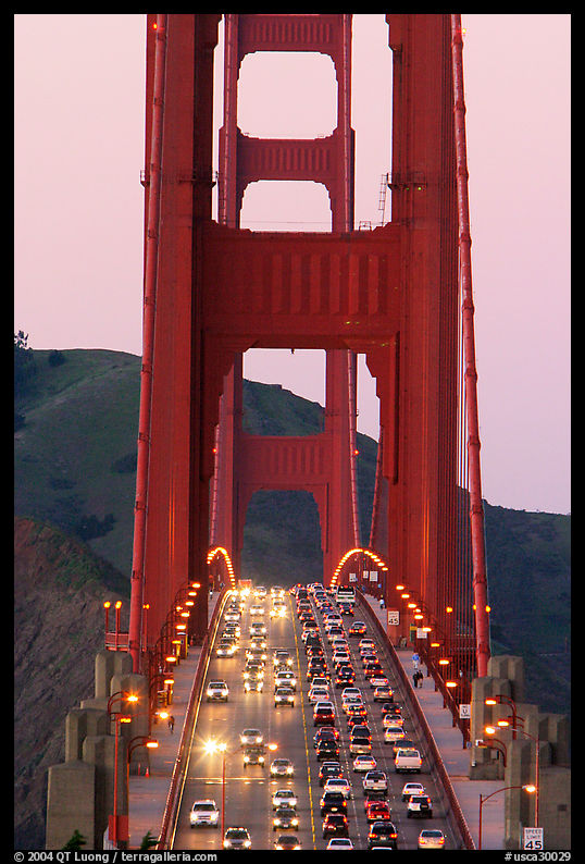 Traffic on Golden Gate Bridge at sunset. San Francisco, California, USA