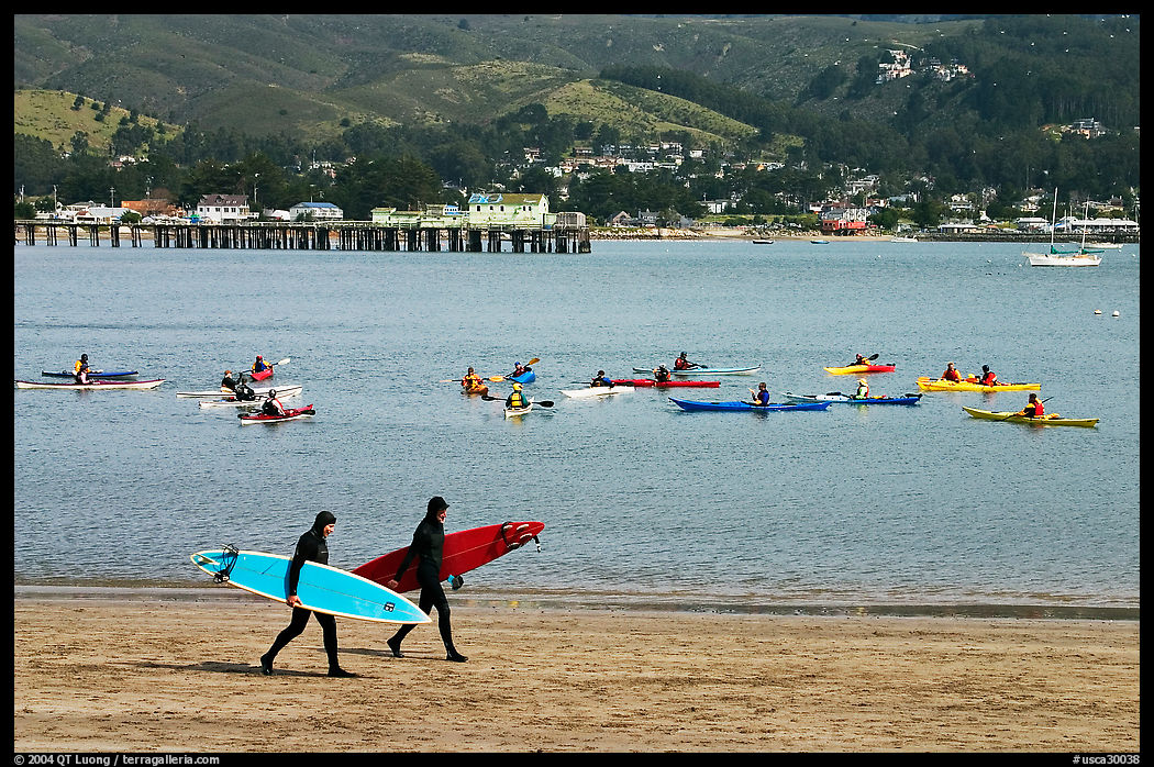 Surfers and sea kayakers, Pillar point harbor, Half Moon Bay. Half Moon Bay, California, USA