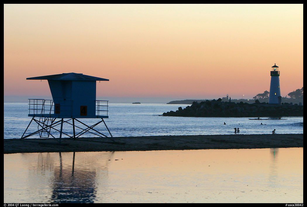 Beach cabin and lighthouse, Twin Lakes State Beach, sunset. Santa Cruz, California, USA
