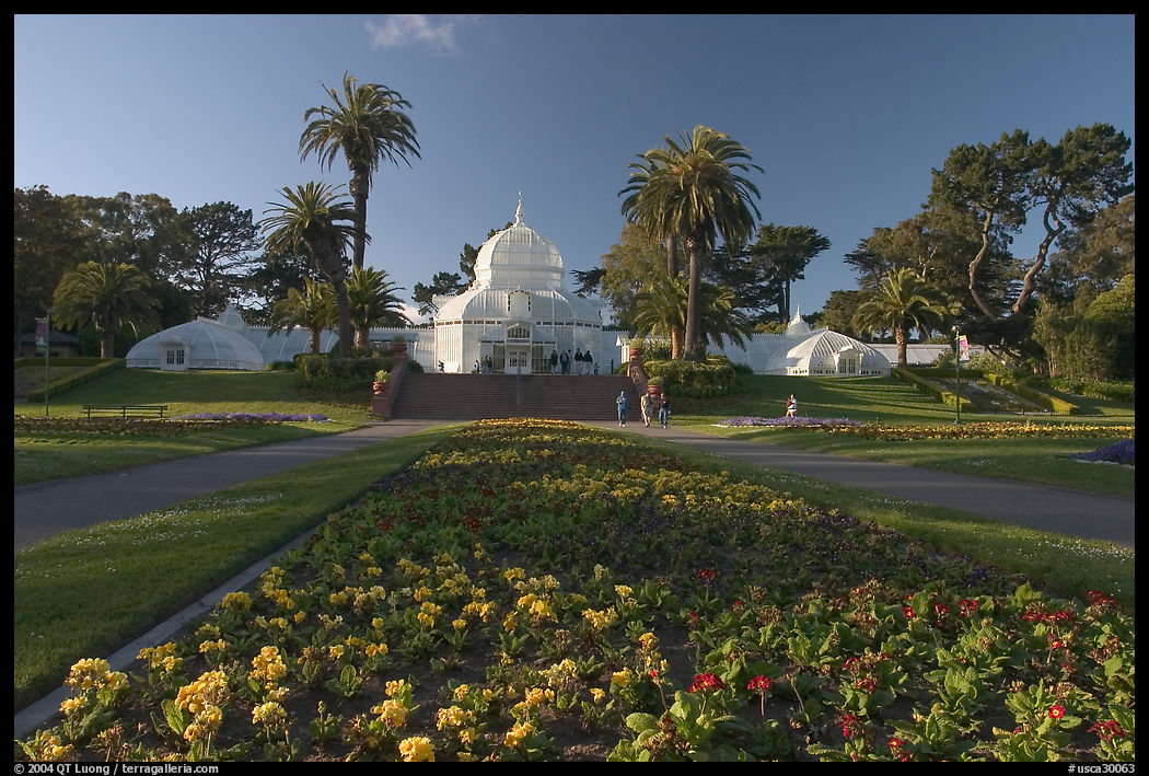 Flower bed and Conservatory of the Flowers, late afternoon, Golden Gate Park. San Francisco, California, USA
