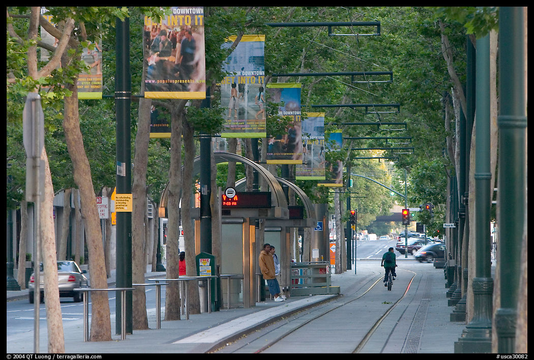 Downtown tree-lined street with tram lane. San Jose, California, USA