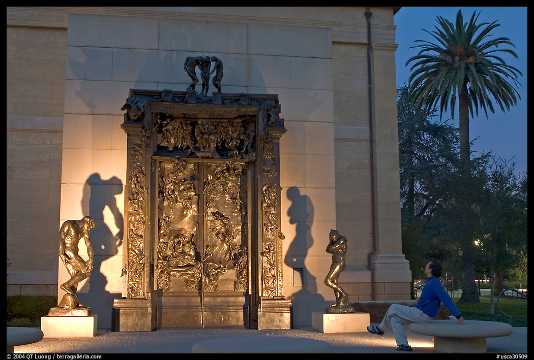 Visitor contemplating Rodin's Gates of Hell in the Rodin sculpture garden. Stanford University, SF Bay area, California, USA