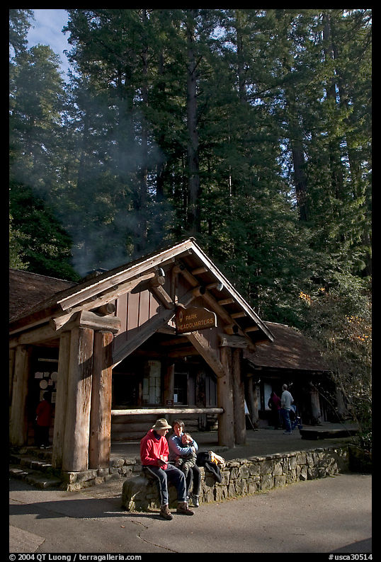 Couple sitting in front of park headquarters, afternoon. Big Basin Redwoods State Park, SF Bay area, California, USA