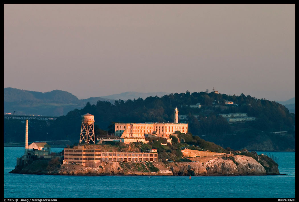Alcatraz Island at sunset, with Yerba Buena Island in the background. San Francisco, California, USA