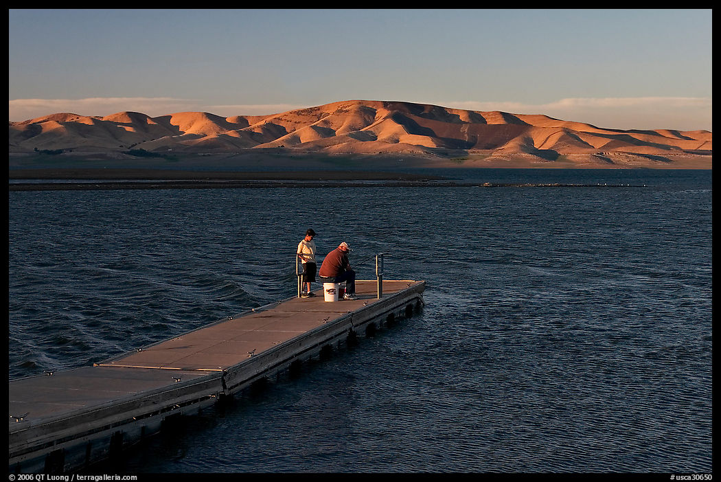 Fishing on San Luis Reservoir at sunset. California, USA