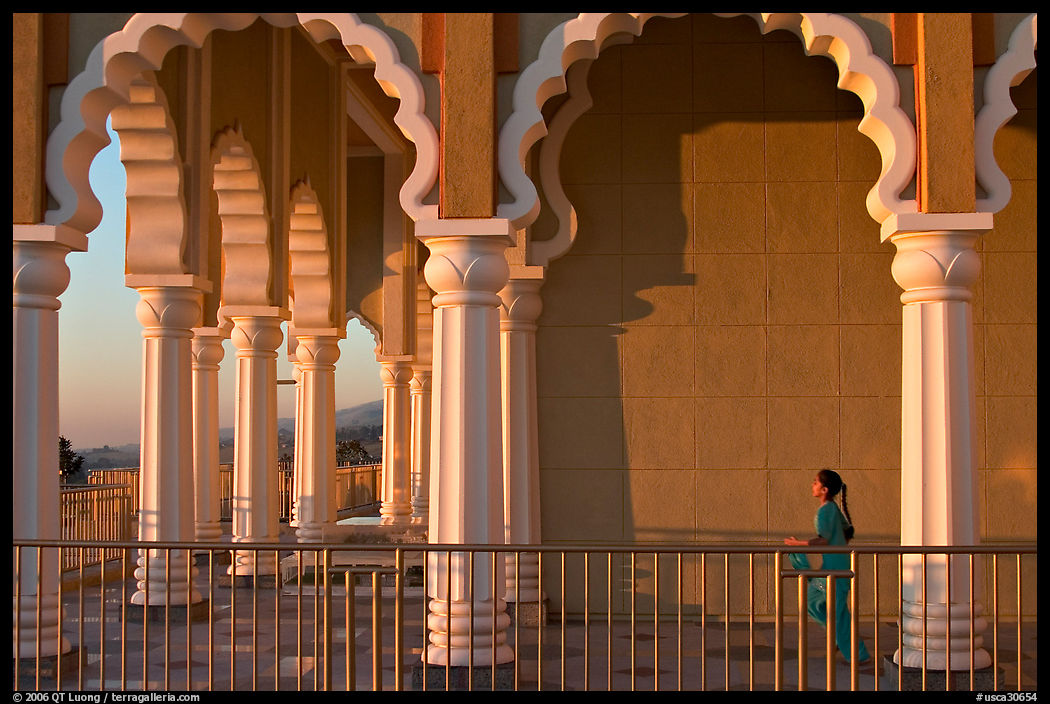 Indian girl running amongst columns of the Sikh Temple. San Jose, California, USA