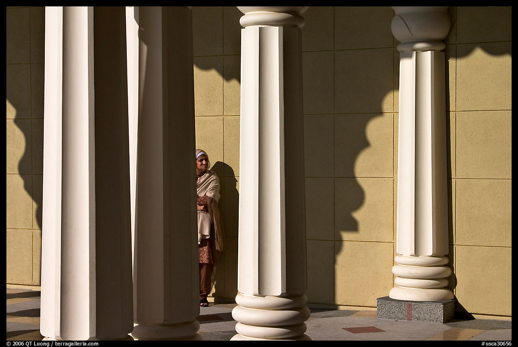 Woman and colonade, Sikh Gurdwara Temple. San Jose, California, USA