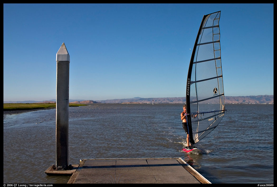 Windsurfer near deck, Palo Alto Baylands. Palo Alto, SF Bay area, California, USA