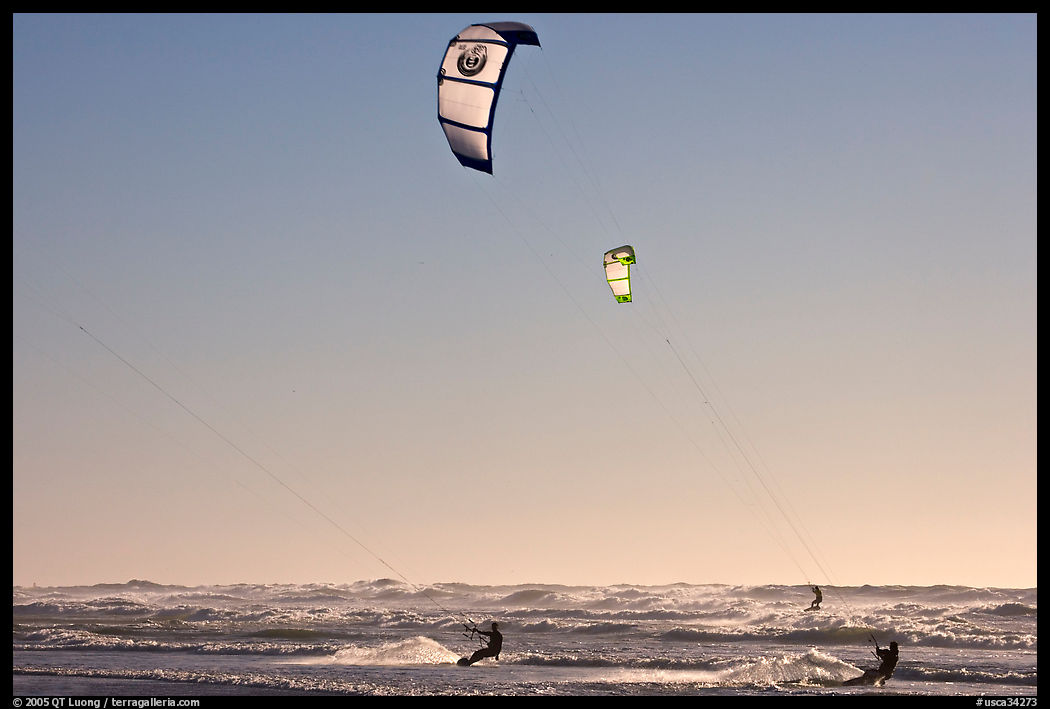 Kite surfers and Pacific Ocean waves, late afternoon. San Francisco, California, USA