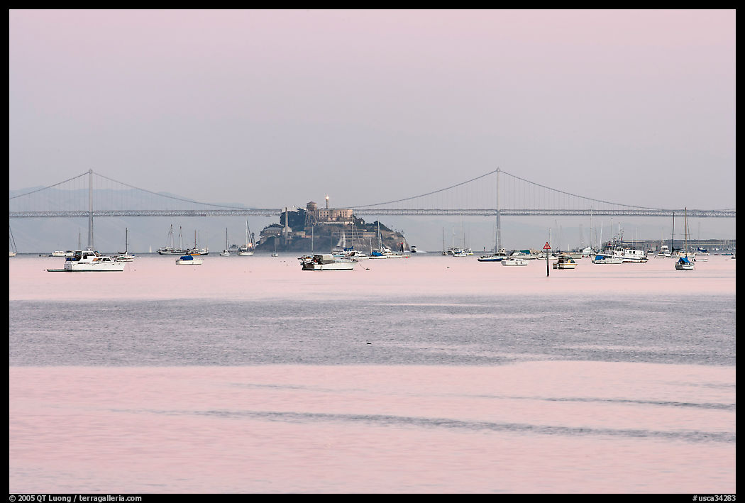 Harbor in Richardson Bay and city skyline painted in pink hues at sunset. San Francisco, California, USA