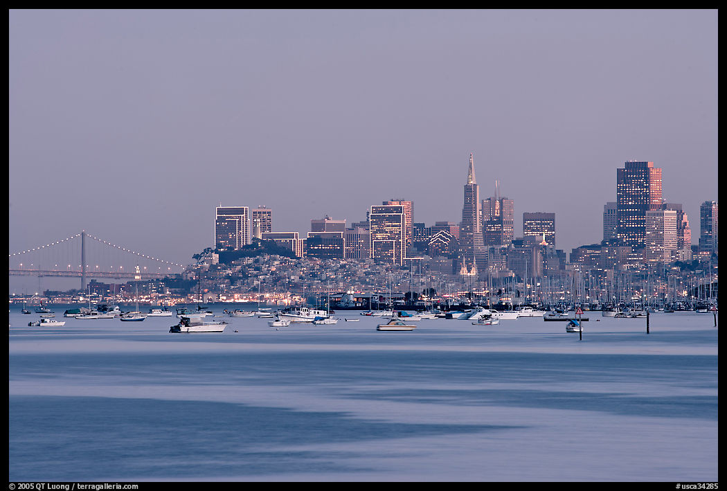 Harbor in Richardson Bay with houseboats and city skyline at dusk. San Francisco, California, USA