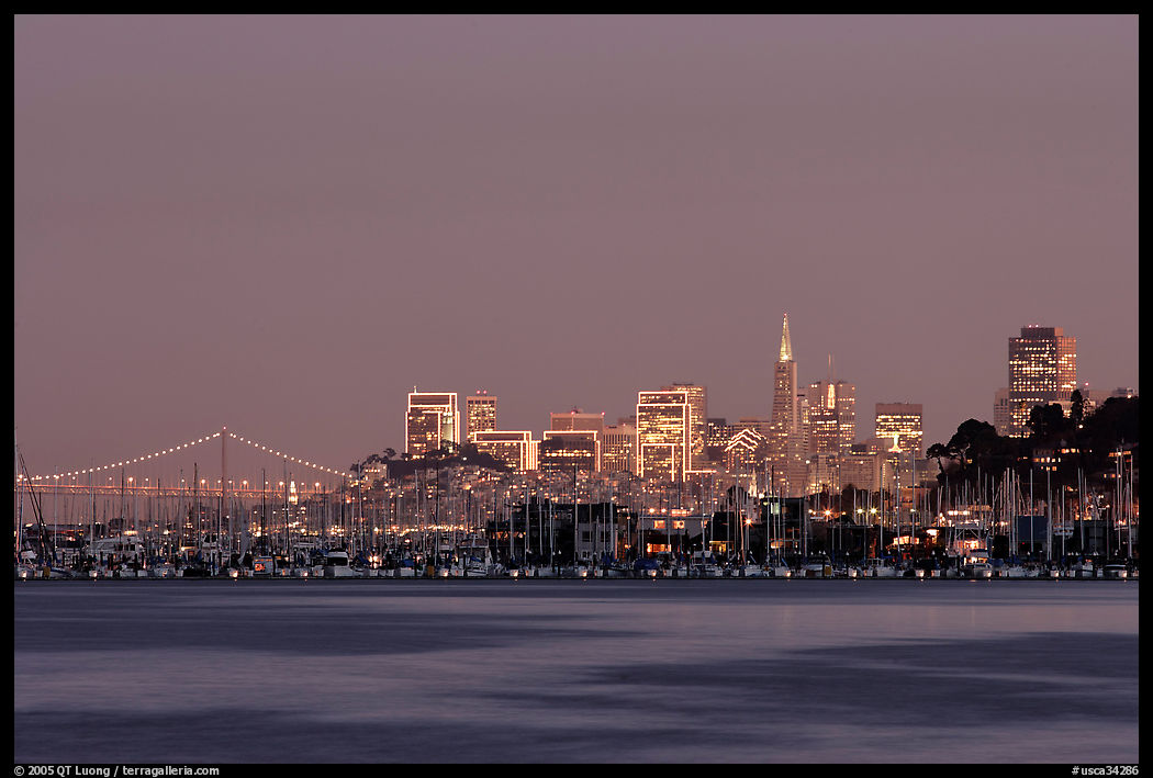 Sausalito houseboats and San Francisco skyline at night. San Francisco, California, USA