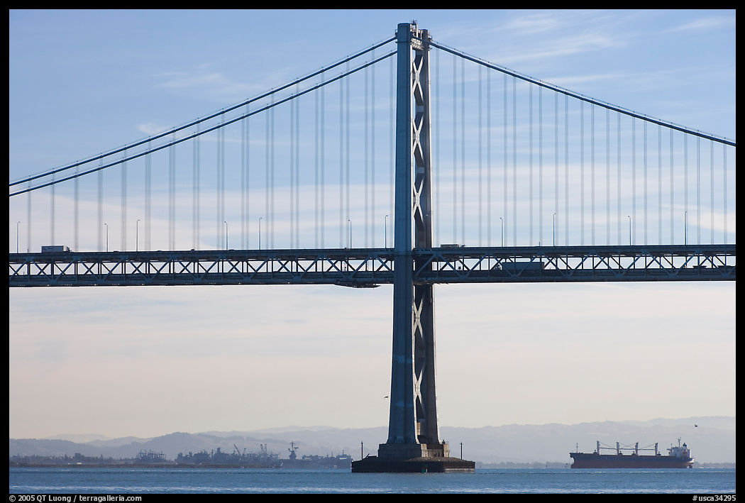 Traffic on Oakland Bay Bridge and tanker ship. San Francisco, California, USA