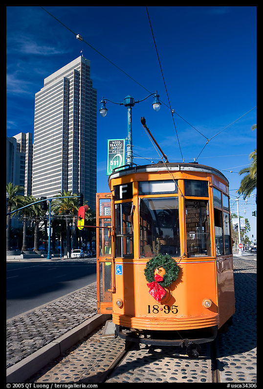 Historic trolley car and Embarcadero center building. San Francisco, California, USA