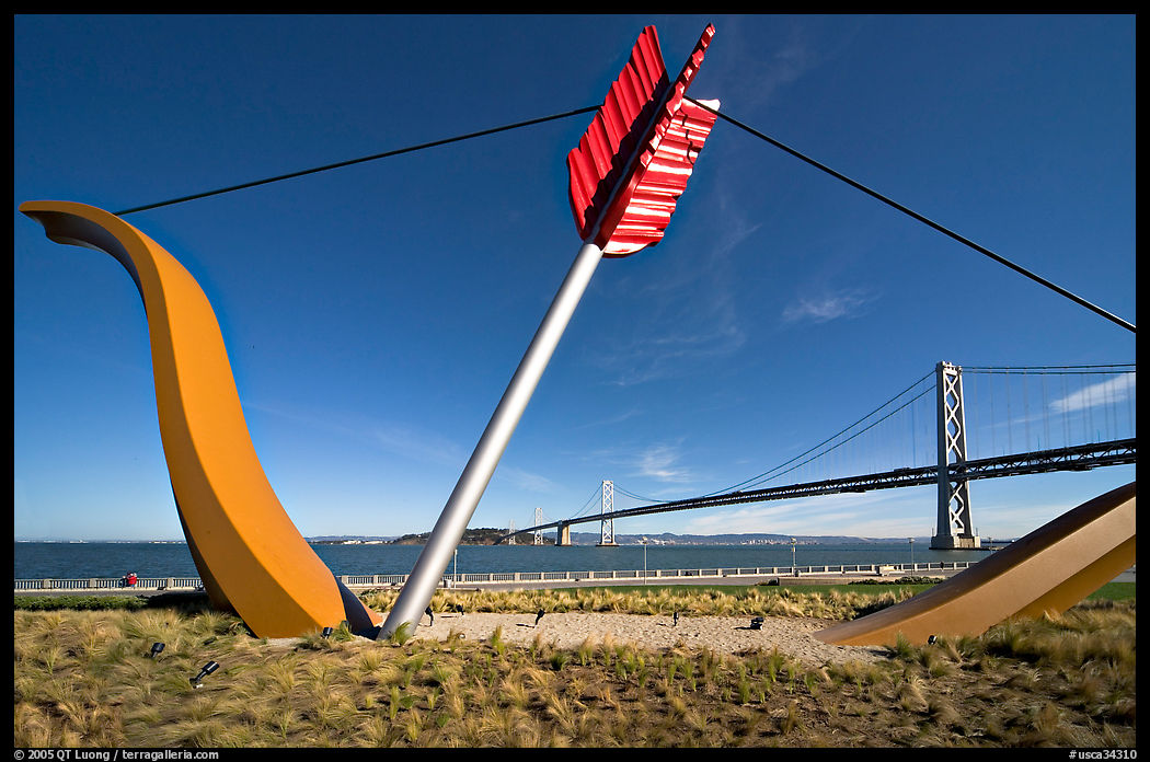 Modern sculputure called Cupid's arrow, framing the Bay Bridge. San Francisco, California, USA