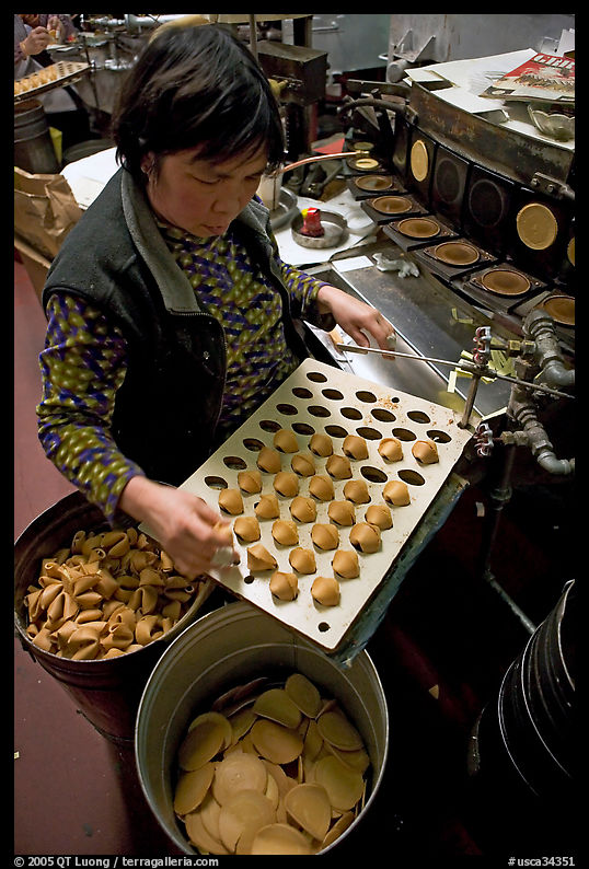Fortune cookies being folded with great dexterity, Chinatown. San Francisco, California, USA