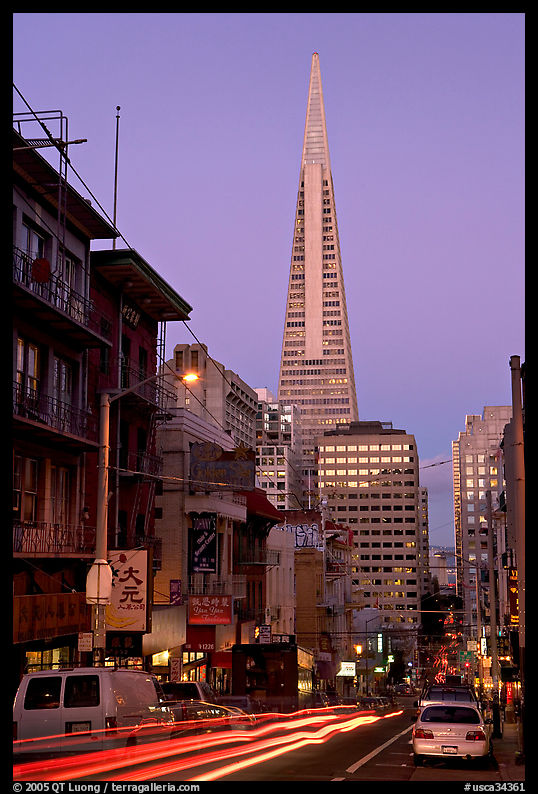 Chinatown street and Transamerica Pyramid, dusk. San Francisco, California, USA