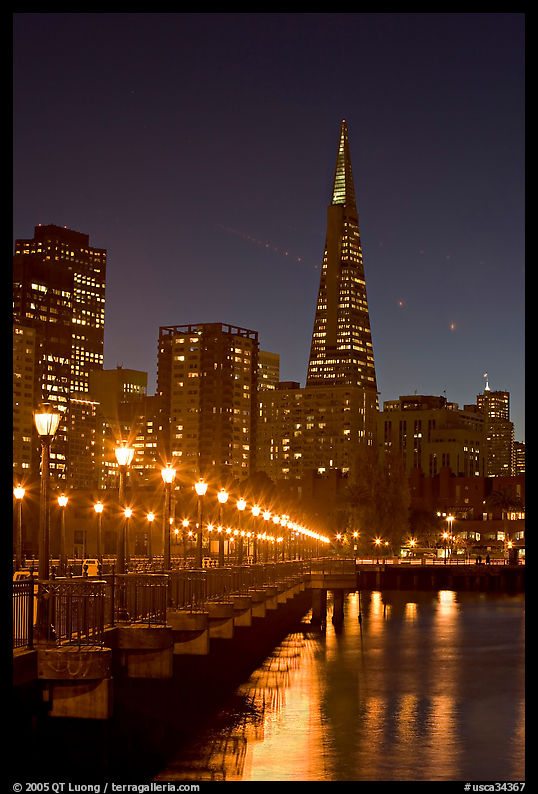 Transamerica Pyramid and Pier seven reflections at night. San Francisco, California, USA