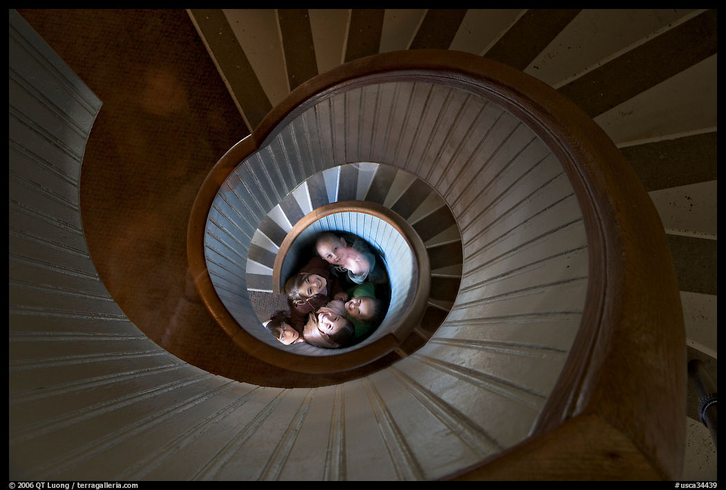 Children standing at the bottom of stairwell, Point Loma Lighthous. San Diego, California, USA