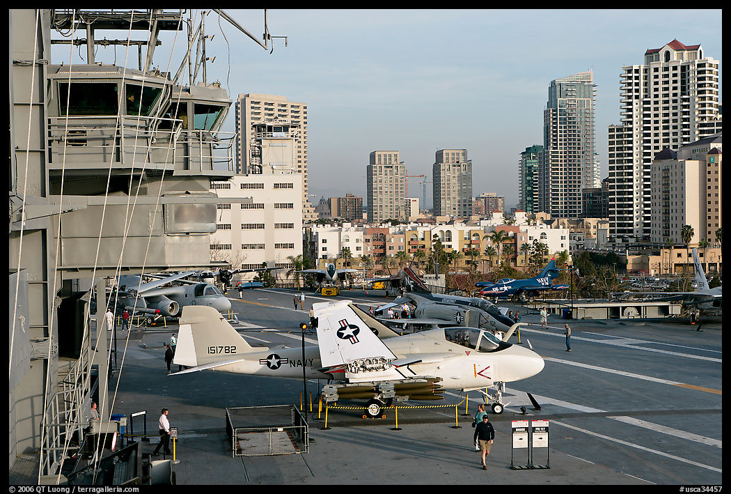 Flight control tower, aircraft, San Diego skyline, USS Midway aircraft carrier. San Diego, California, USA