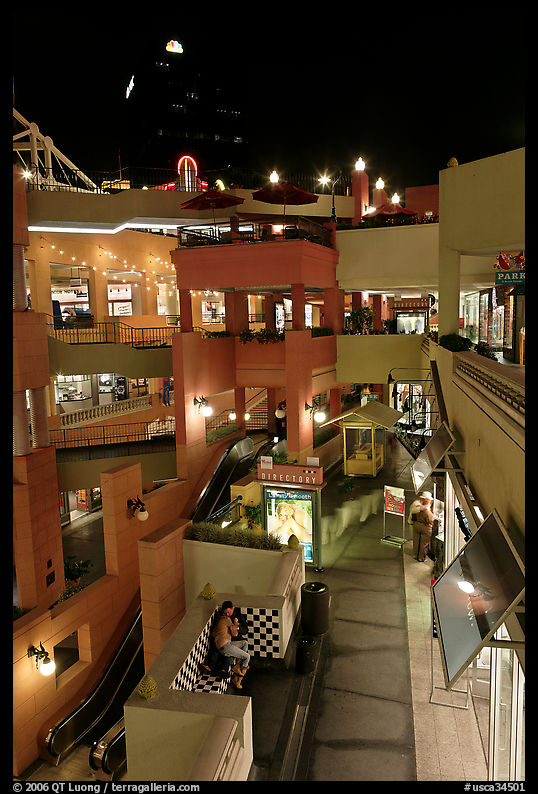 Some of the 140 stores in the Horton Plaza shopping mall at night. San Diego, California, USA