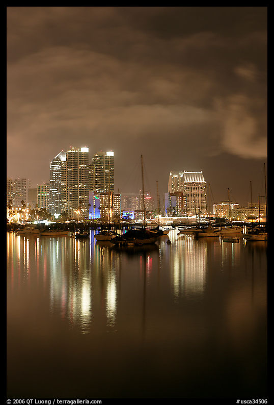 Yachts and skyline from Harbor Drive, at night. San Diego, California, USA
