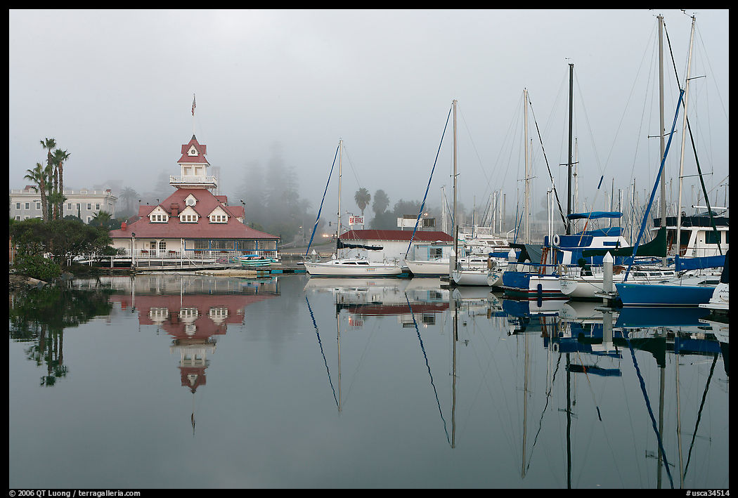 Boats and historic Coronado boathouse in fog. San Diego, California, USA