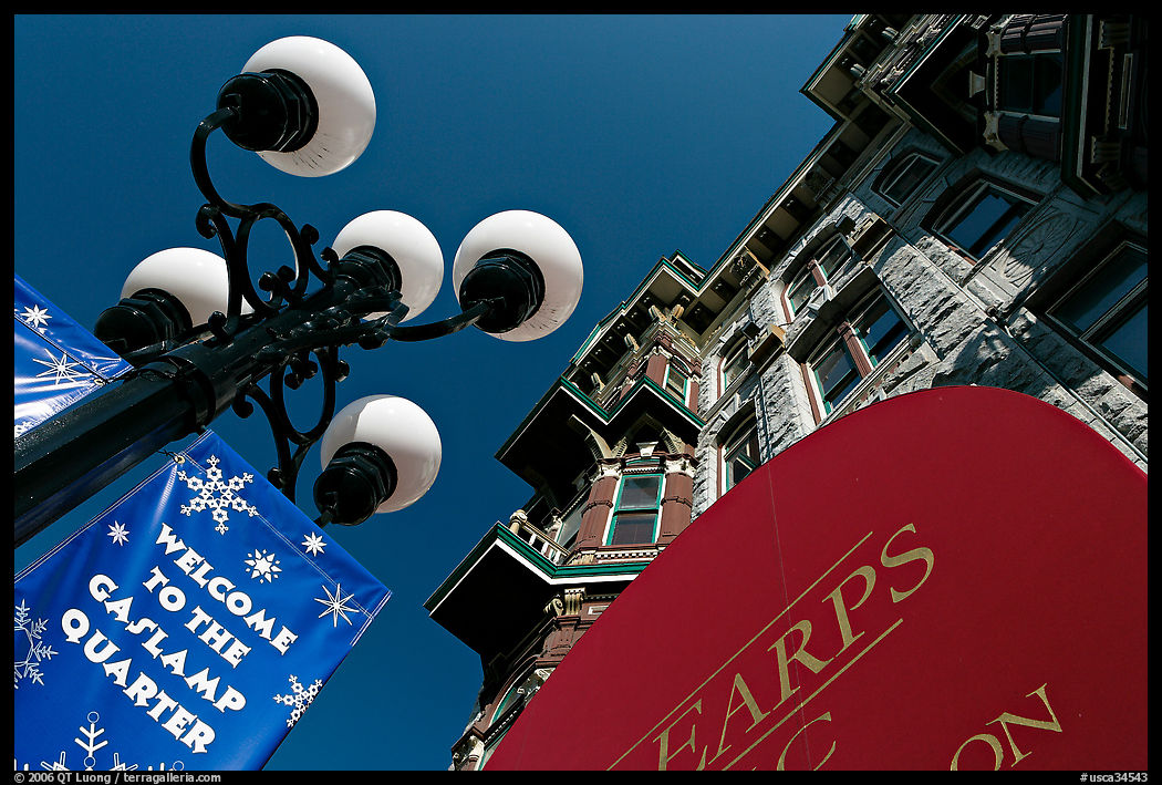 Gaslamp, welcome to Gaslamp quarter signs, and historical building facade. San Diego, California, USA