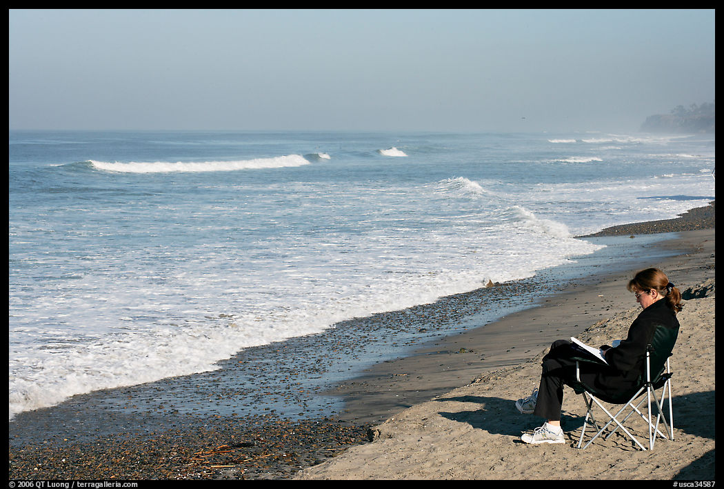 Woman reading on the beach. La Jolla, San Diego, California, USA