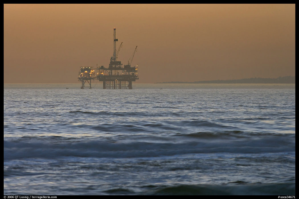 Off-shore petrol extraction  platforms, sunset. Huntington Beach, Orange County, California, USA