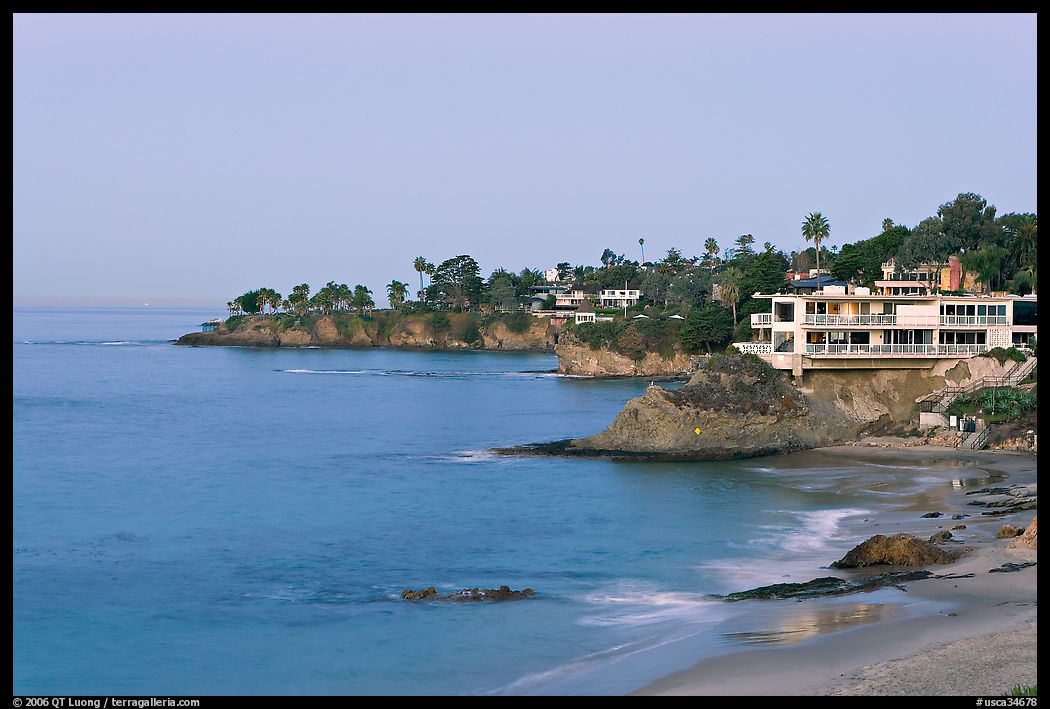 Rocky coastline with waterfront houses at dawn. Laguna Beach, Orange County, California, USA
