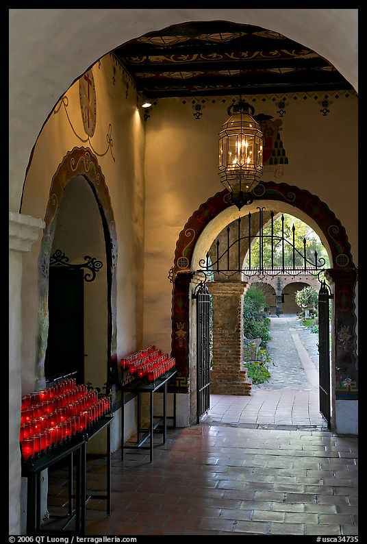 Corridor with candles next to the Serra Chapel. San Juan Capistrano, Orange County, California, USA