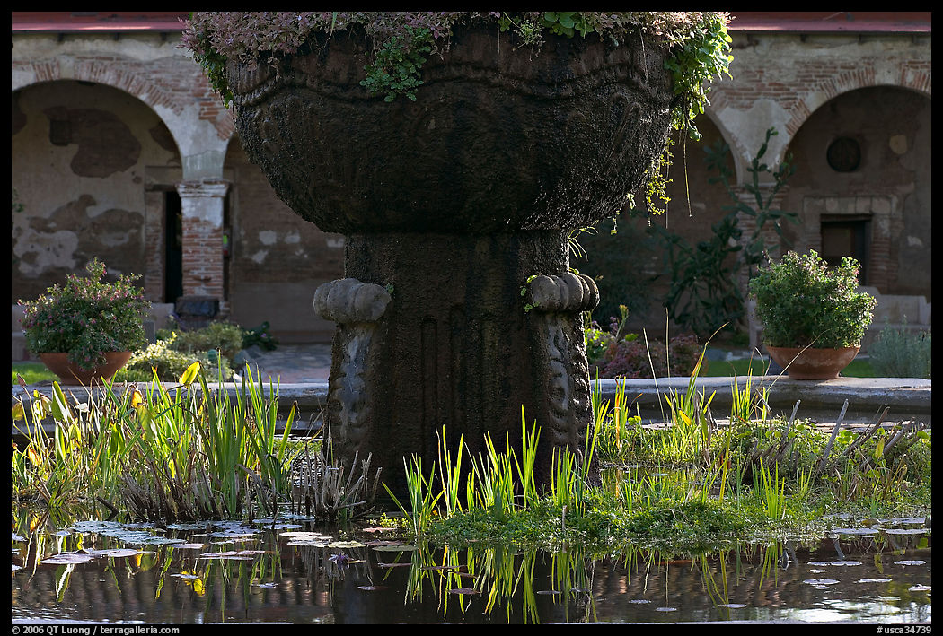 Moorish-style fountain and  courtyard arches. San Juan Capistrano, Orange County, California, USA