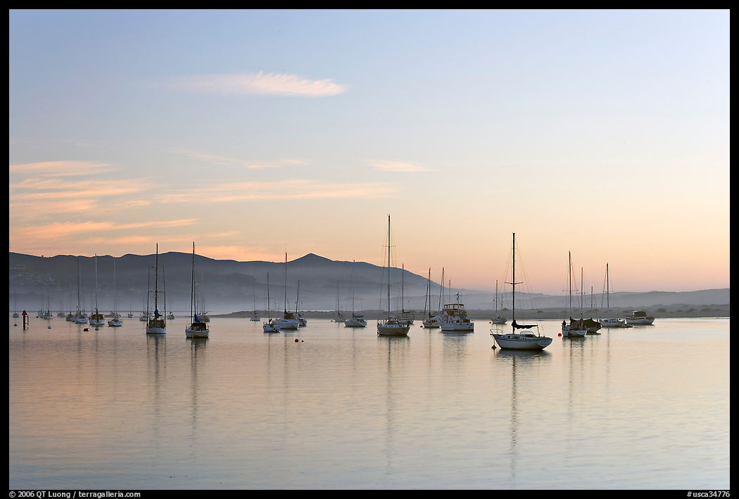 Yachts in calm Morro Bay harbor, sunset. Morro Bay, USA