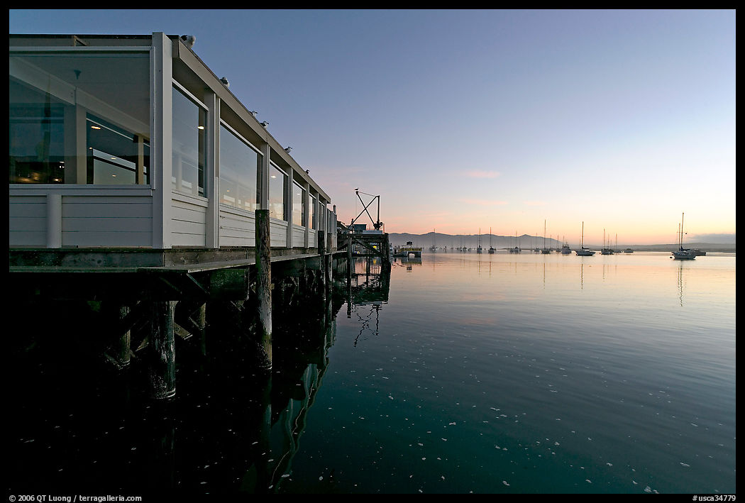 Waterfront restaurant in Morro Bay harbor, sunset. Morro Bay, USA
