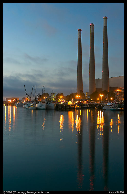 Power station reflected in harbor, dusk. Morro Bay, USA