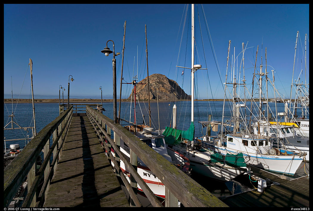 Deck, harbor, and Morro Rock. Morro Bay, USA