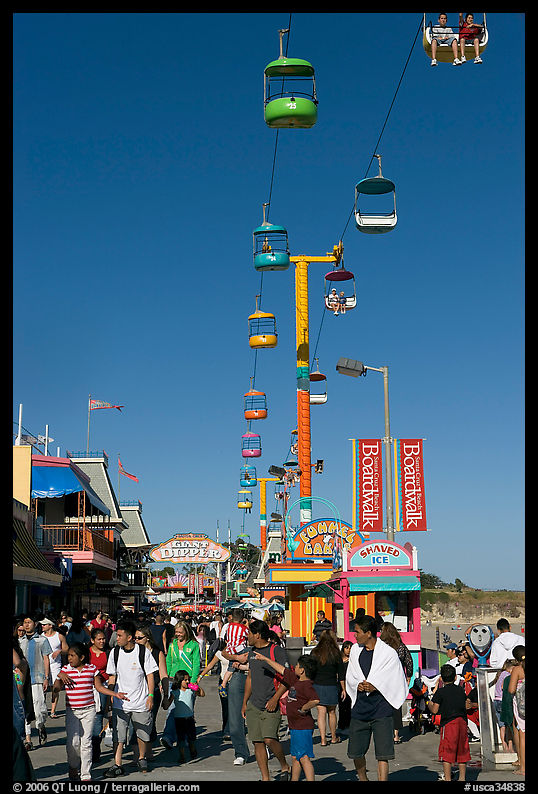 Crowd on the beach boardwalk on a summer afternoon. Santa Cruz, California, USA